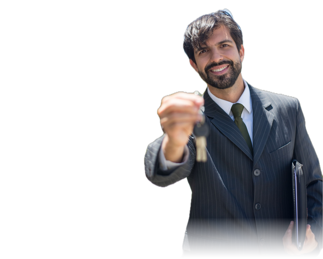 Smiling man in a pinstripe suit holding out a set of house keys, with a folder tucked under his arm